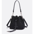 Black woven handbag with chain strap on a white background