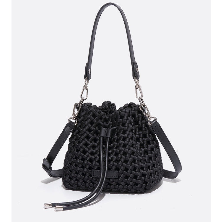 Black woven handbag with chain strap on a white background