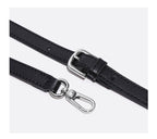 Black leather shoulder strap with silver hardware on a white background