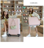 Woman holding a pink suitcase in a store setting with 'Flower Camel' branding.